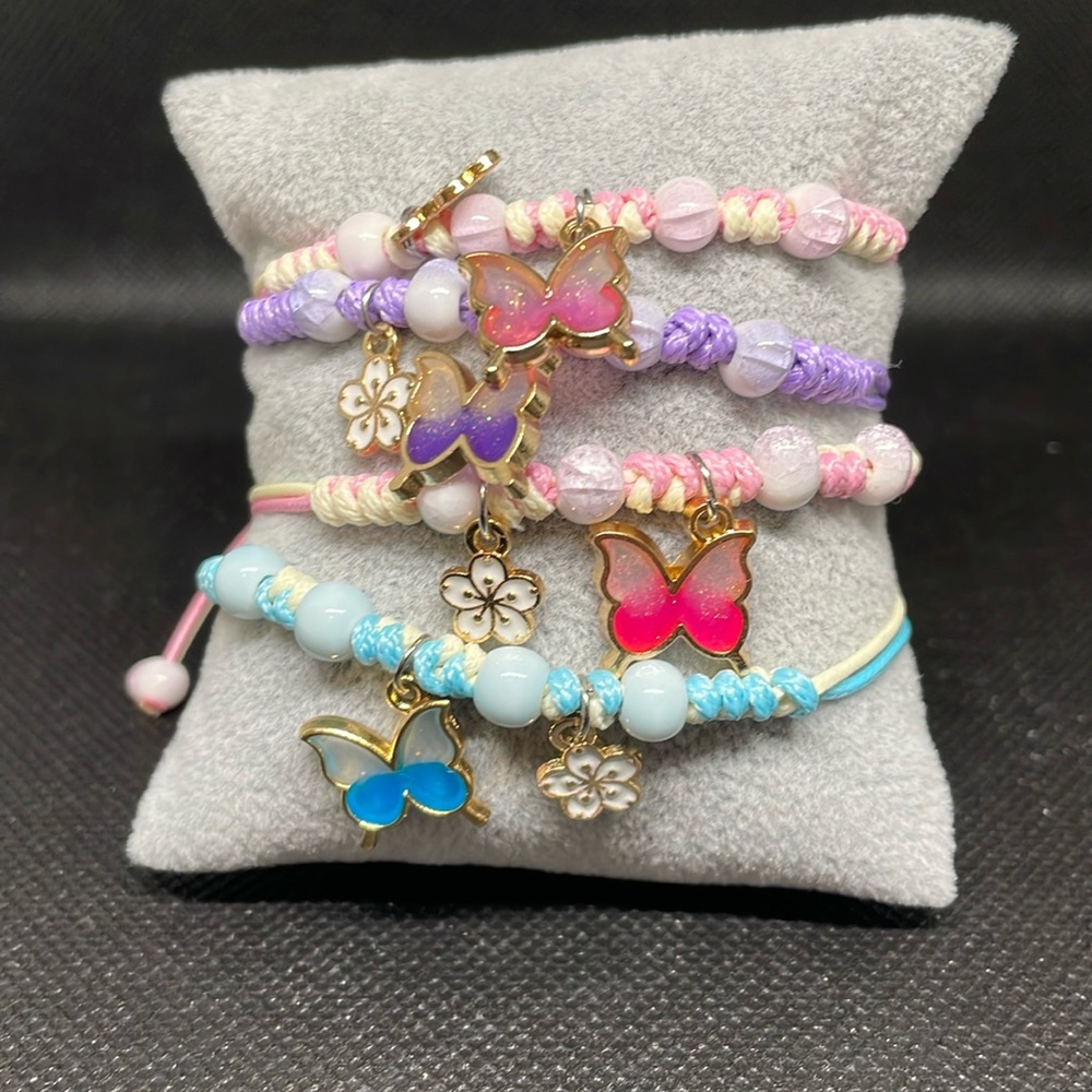 NWOT! 4 piece children’s bracelet with charms